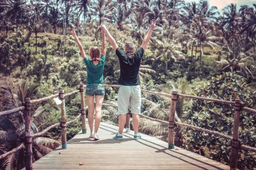 couple happy from kratom benefits on bridge