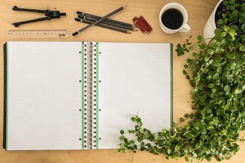 kratom studies book on desk with plant and coffee